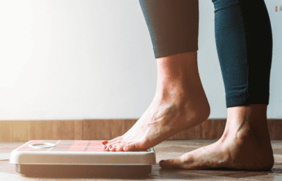 woman stepping on the scale